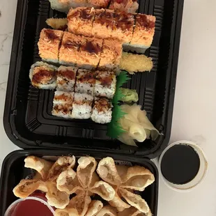 a tray of sushi and chips