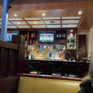 a woman sitting at a bar