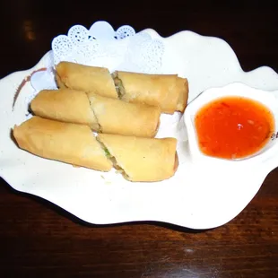 Spring rolls with dipping sauce.