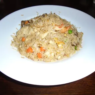 House fried rice with chicken, beef, and shrimp.