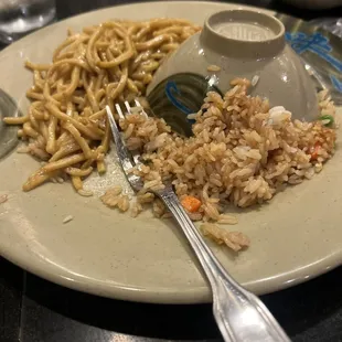 a plate of fried rice and vegetables