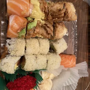 The takeout. Top King's roll, winter roll middle &amp; sake maki &amp; 1 tobiko nigiri