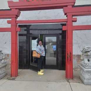 a woman standing in front of the entrance