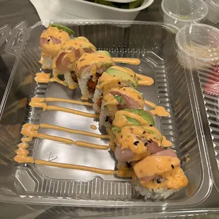 a sushi roll in a plastic container