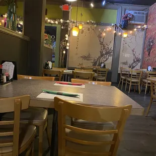 Inside the restaurant; a few more tables on other side of divider