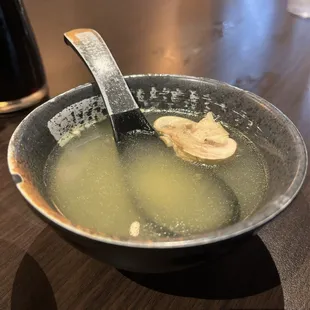a bowl of soup with a spoon
