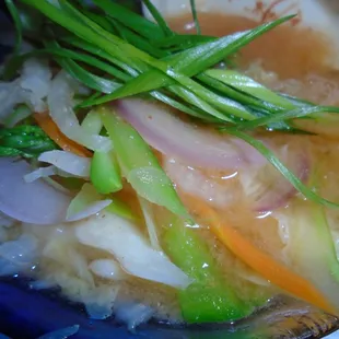 Spicy miso vegetable soup, close-up.