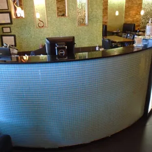 Front host/hostess stand, wait to be seated.