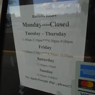 Hours of operation, front entry door.