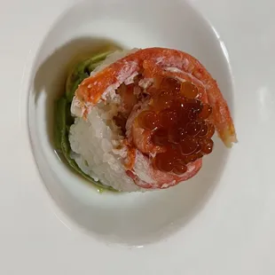 a plate of sushi on a white plate