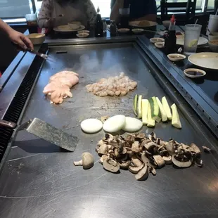 a grill with various types of food on it