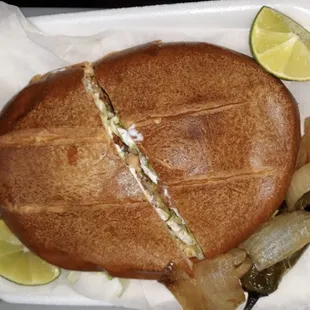 a sandwich in a styrofoam container