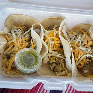 three tacoss in a styrofoam container