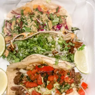 Tacos! Tacos! Tacos! Their tacos have fresh ingredients and are scrumptious. Pictured are Korean BBQ, Pastor and Carnitas.