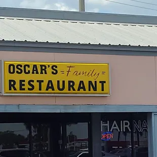 Restaurant sign in strip mall.