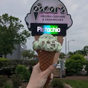 Pistachio frozen custard on their waffle cone