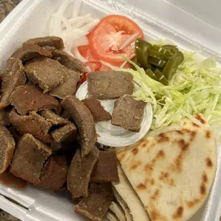 a meal in a styrofoam container
