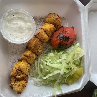 The chicken was orange and was supposed to be a Kabob.