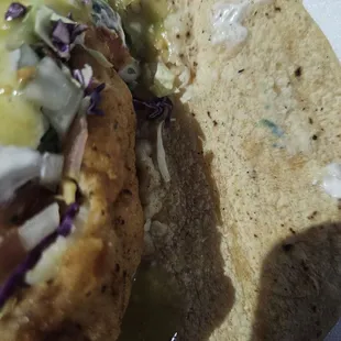 Fish taco. It's got mold on it, and the did even cook or warm up the Tortilla