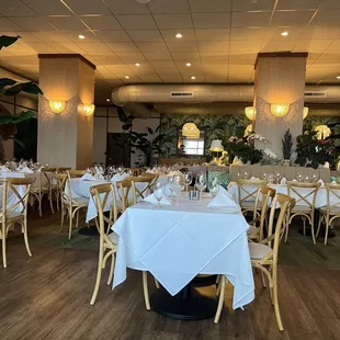 a dining room with tables and chairs