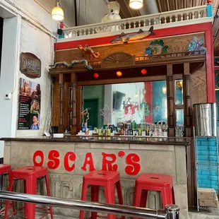 a bar with red stools