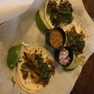 three tacos on a table