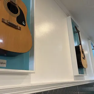 Guitars on the wall.