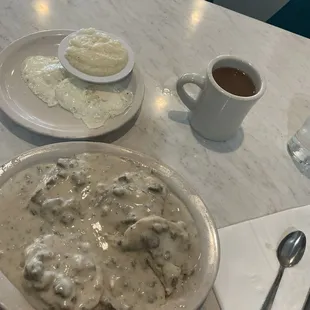 Biscuits and gravy, eggs, grits, coffee