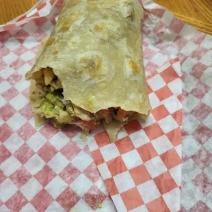 Half eaten chicken burrito