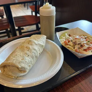 Burrito con carne asada. And fish taco.