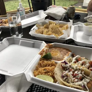 Lunch on our patio. Fish Tacos, Queso Blanco with chips &amp; partially hidden Breakfast Burrito.