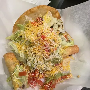 Two rolled tacos, taco and bean tostada (daily special)