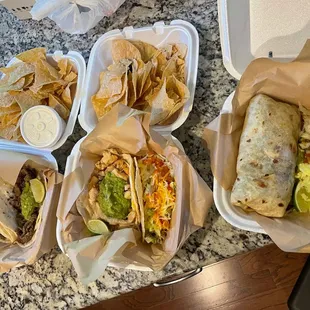 a variety of tacos and chips