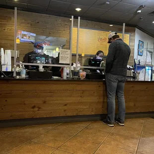 a man standing at the counter