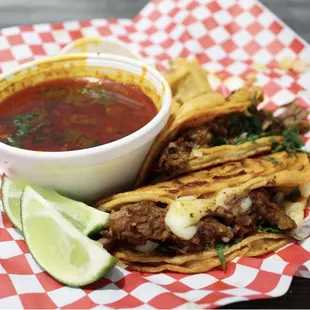 a plate of quesadillas and a bowl of salsa