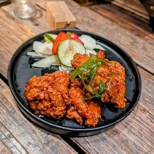 a plate of food on a wooden table