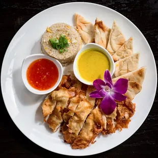 Fried Chicken served with sweet chili sauce, yellow curry sauce , egg fried rice &amp; flatbread