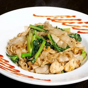 Pad See Ew , Wok-fried flat rice noodle, egg, and chinese broccoli with black bean sauce.