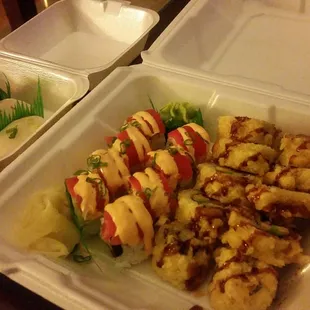 Left to right: ikura nigiri, white tuna nigiri, spicy tuna roll, crunchy unagi roll