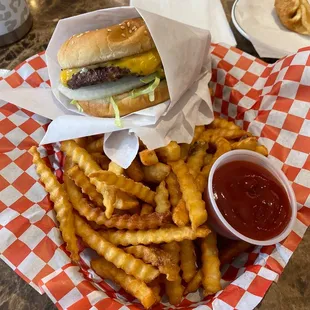 a basket of fries and a sandwich