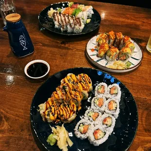 Front: Friday Night Roll Spicy Tuna Roll Middle: Cherry Blossom Roll Back: Rainbow Roll Shrimp Tempura Roll