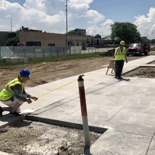 Jeffrey, our General Manager, and Kim, our Retail Specialist, are measuring for our outdoor patio area.