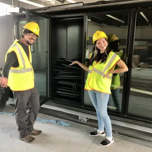 Jeffrey, our General Manager, and Kianna, our Marketing Assistant, are standing in front of the future home of our local meat area.