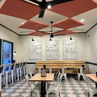 a restaurant with tables and chairs