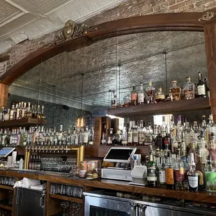 a bar with a large mirror