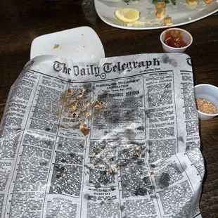 The paper used to hold fried items is fake newspaper from 1969 - it&apos;s a great touch