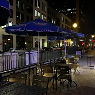 tables and umbrellas at night