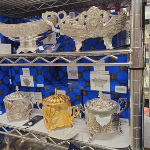 a shelf of silverware