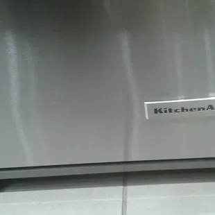 a kitchenaid logo on a stainless steel dishwasher