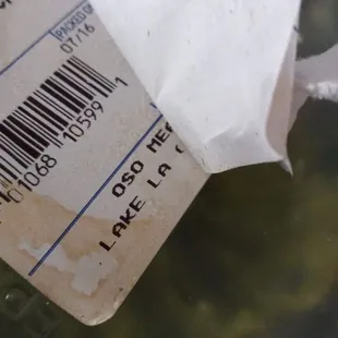 a piece of paper in a bowl of broth